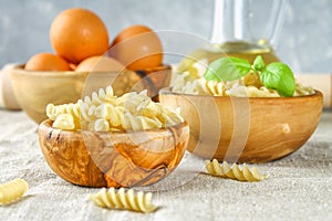 Helix- or corkscrew-shaped pasta. Rotini macaroni. Related to fusilli, but has a tighter helix, i.e. with a smaller pitch.