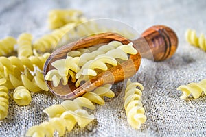 Helix- or corkscrew-shaped pasta. Rotini macaroni. Related to fusilli, but has a tighter helix, i.e. with a smaller pitch.