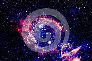 The Helix Nebula in deep space. Elements of this image furnished by NASA