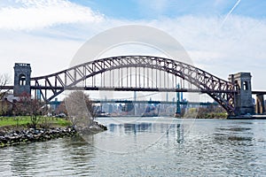 The Hell Gate Bridge over the East River during Spring in Astoria Queens New York