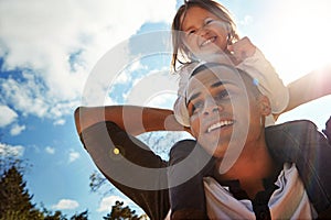 Hell always support her no matter what. a happy father and daughter enjoying a piggyback ride outdoors.