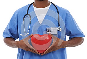 Hell take care of your cardiological needs. Cropped image of an african doctor holding a heart prop.