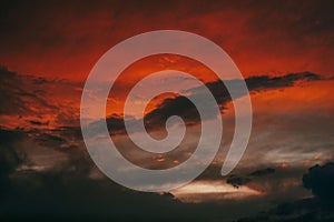 Hellish scenery of abstract clouds in the crimson sky