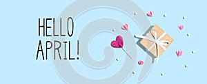 Hello April message with a small gift box and hearts