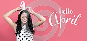 Hello April message with woman with Easter theme