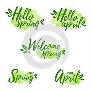 Hello april spring text, green watercolor shapes, spots