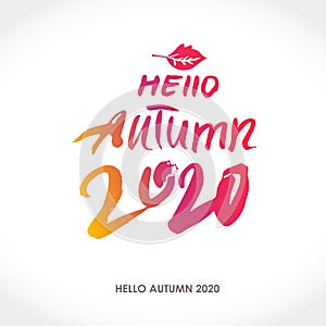 Hello Autumn 2020. Seasonal poster. Calligraphy on the background of a yellow brown autumn leaf.