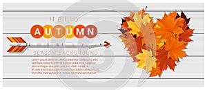 Hello autumn background with heart shape leaves and arrow on wooden board