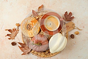 Hello autumn concept  with coffee cup, cookie and white pumpkin on stone background. Top view, flat lay