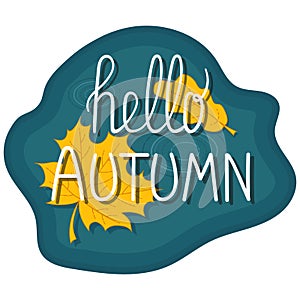 Hello autumn hand lettering phrase. Background puddle with leaves.