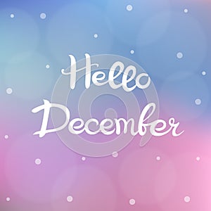 Hello December. Lettering. White handwritten text on a gentle blurry background with bokeh