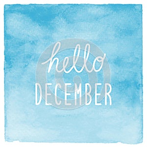 Hello December text with blue watercolor background