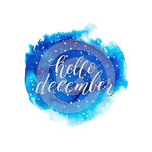 Hello december text on blue watercolor splash