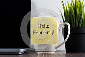 Hello February on adhesive note stick on coffee cup