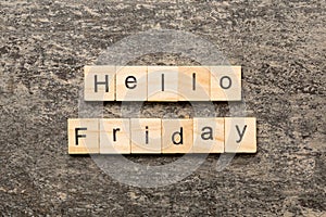 hello friday word written on wood block. hello friday text on cement table for your desing, concept