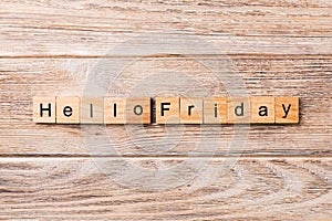 Hello friday word written on wood block. hello friday text on wooden table for your desing, concept