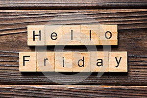 Hello friday word written on wood block. hello friday text on wooden table for your desing, concept