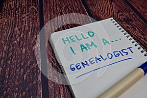 Hello I am A Genealogist write on a book Isolated on wooden table background photo