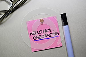 Hello I am Onboarding text on sticky notes isolated on office desk