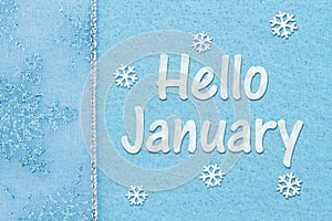 Hello January message with snowflakes on blue felt