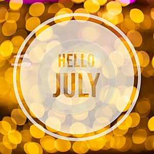Hello july words on yellow bokeh background