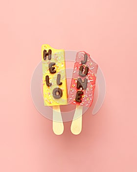 Hello June!. Pastel pink real ice creams with chocolate text.