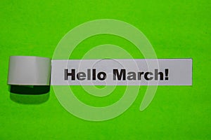 Hello March! holiday concept on green torn paper