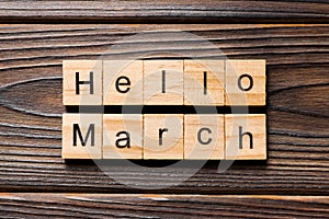 Hello March word written on wood block. Hello March text on table, concept