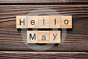 Hello May word written on wood block. Hello May text on table, concept