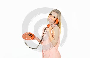 Hello. modern and vintage technology. telephone conversation with friend. Cheerful woman talking on land line phone