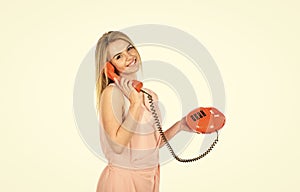 Hello. modern and vintage technology. telephone conversation with friend. Cheerful woman talking on land line phone
