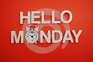 Hello Monday alphabet letters on red background