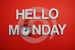 Hello Monday alphabet letters on red background