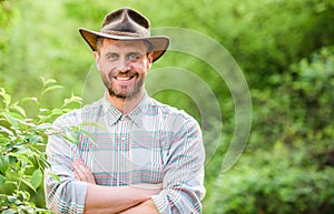 Hello. muscular ranch man in cowboy hat care plants. Eco farm worker. Harvest. happy earth day. Eco living. farming and