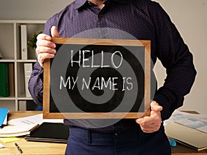 Hello My Name is... text on the board held by manager