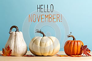 Hello November message with pumpkins