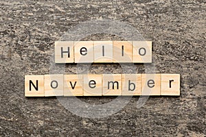 hello november word written on wood block. hello november text on table, concept