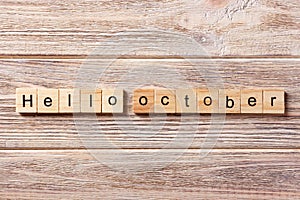 Hello October word written on wood block. Hello October text on table, concept