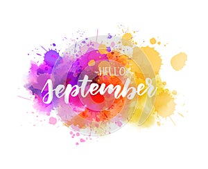 Hello September lettering on watercolor splash