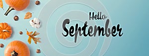 Hello September message with autumn pumpkins