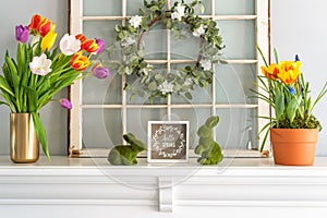 Hello Spring sign with tulips on the mantel