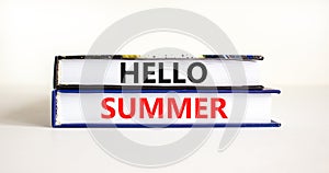 Hello summer symbol. Concept words Hello summer on beautiful books. Beautiful white paper background. Business lifestyle Hello