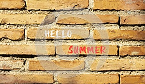 Hello summer symbol. Concept words Hello summer on beautiful brick wall. Beautiful red brown brick wall background. Business