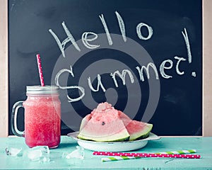 Hello summer written on the blackboard