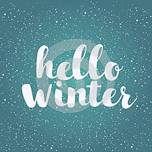 Hello winter text. Brush lettering at blue winter background with snowflakes and bokeh lights. Vector card design with