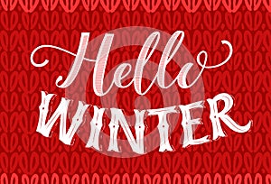 Hello winter text on red knitted texture. Vintage banner with hand lettering. Winter season vector retro card.