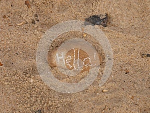 Hello Written on a stone in the sand