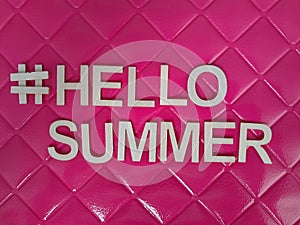 #hellosummer hello summer message on a pink background