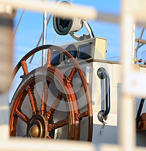 Old helm on sailing ship in morning light