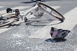 Helmet and bicycle on pedestrian crossing after accident